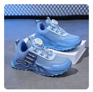 Children sports shoe detail view, breathable mesh upper featuring a convenient dial lacing system.