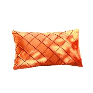 Orange velvet throw pillow cover with stylish pleated diamond pattern for home sofa decor.