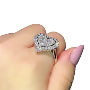 Stunning heart-shaped pavé diamond engagement ring showcased on a finger, main product view.