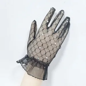 Black lace short gloves with rhinestone embellishments and ruffles, elegant evening party wear.