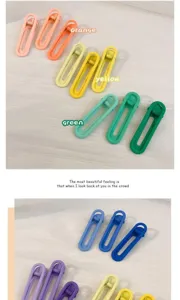 Vue détaillée de pinces à cheveux ovales et creuses aux superbes tons pastel doux.