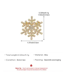 Elegant gold snowflake brooch decorated with sparkling rhinestones for women winter fashion style.