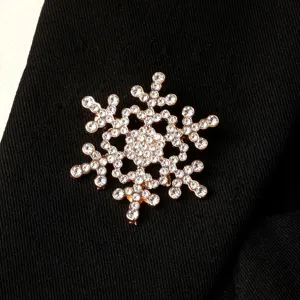 Elegant rhinestone snowflake brooch for women, sparkling crystal pin for winter clothing and parties.