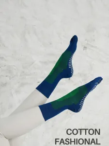 Detail shot of non-slip five toe yoga socks with grip dots for pilates and fitness workouts.