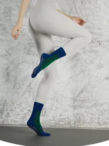 Detailed view of women's non-slip five-toe yoga socks, cotton split-toe fitness wear.