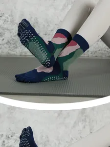 Non-slip five-toe yoga socks with grip dots for pilates, fitness, and indoor workouts.