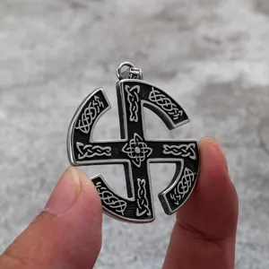 Stainless steel vintage Slavic sun wheel pendant detail showing intricate Viking knotwork.