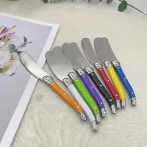 Colorful stainless steel butter spreader knife set with vibrant handles for kitchen dining.