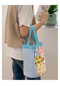 Joli sac cabas en toile pour femme, sac seau imprimé décontracté et sac à lunch quotidien.