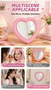 Pink heart shaped makeup vanity mirror with cute beaded frame for desktop and wall decor.