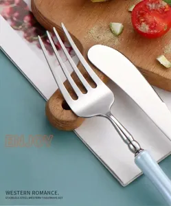 Stainless steel fork and knife set with light blue handle for western dining experience.