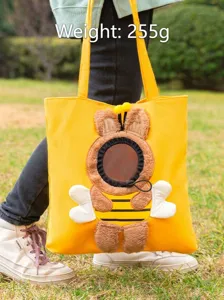 Cute canvas pet tote bag with breathable head-out hole for cats and small dogs outdoor travel.