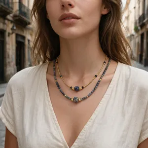 Layered blue stone beaded necklace detail shot, bohemian style gold bead jewelry for women.