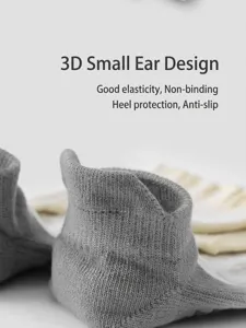 Detailed view of grey yoga socks with anti-slip heel and cute 3d ear design for women fitness.