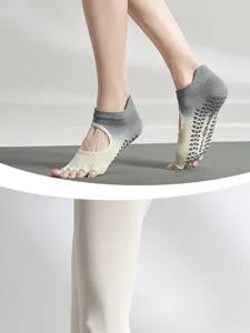 Professional non-slip five-toe yoga socks with grip for women indoor fitness pilates training.