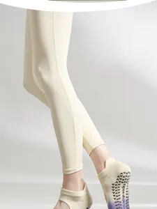 Professional non-slip yoga socks for women, breathable cotton pilates fitness socks detail view.