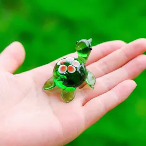 Glass turtle figurine detail, miniature green turtle ornament for desktop decor.