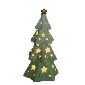Green ceramic Christmas tree night light with star cutouts for desktop holiday decor.