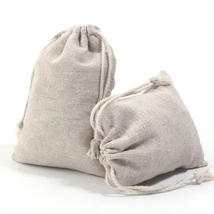 Detail shot of beige linen drawstring jute pouches, showing natural texture and sturdy design.