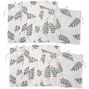 Linen drawstring pouch with green leaf print, ideal for jewelry, herbs and small gifts.