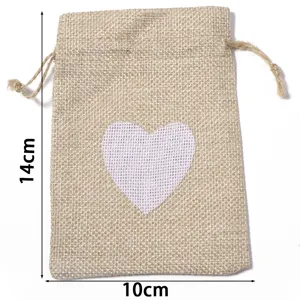 Linen jute drawstring gift pouch with white heart print detail, rustic storage bag.