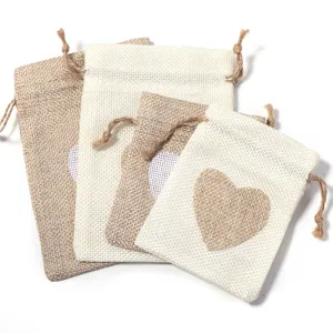 Detailed view of linen drawstring pouch featuring a heart print, perfect for herbs and gifts.