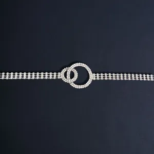 Rhinestone waist chain detail, sparkling silver metal body chain with double circles.