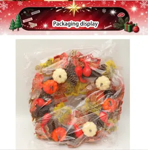 Autumn Thanksgiving wreath artificial maple leaves pine cones pumpkins packed detail view.