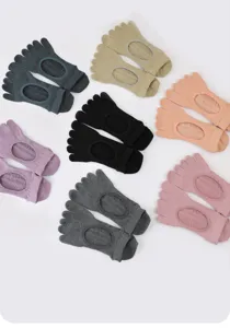Detailed view of multi-color five-toe yoga socks, non-slip grip design for indoor fitness training.