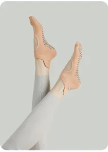 Detailed close-up view of open-heel anti-slip pilates socks for indoor yoga training.