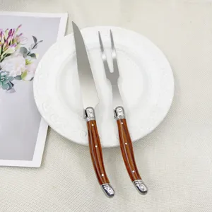 Ensemble de couteau et fourchette à découper en acier inoxydable manche en bois.