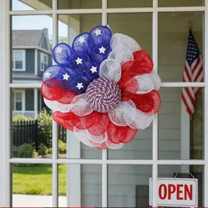 American flag mesh wreath detail, patriotic door hanging decor for USA independence day celebration.