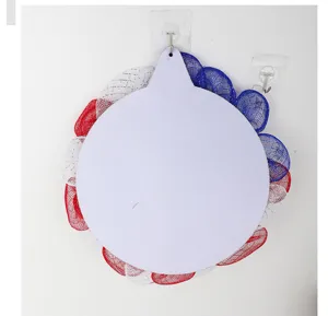 Details of the red white and blue mesh wreath with center blank sign for patriotic holiday decor.