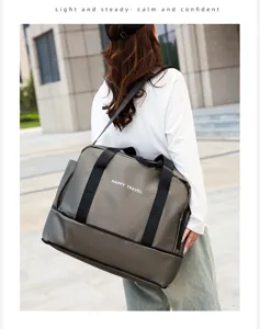 Large capacity travel fitness gym duffel bag detail view with shoulder strap and waterproof fabric