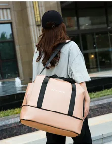 Detailed view of the large capacity travel duffel bag with comfortable straps for fitness use.