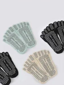 Non-slip five toe yoga socks detail view, breathable athletic grip socks for women.