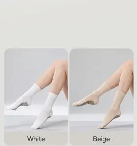 Detail view of solid color non-slip yoga socks, featuring grip dots for pilates and fitness.
