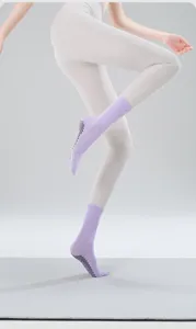 Detailed view of women's solid color grip yoga socks, anti-slip pilates fitness mid-tube.
