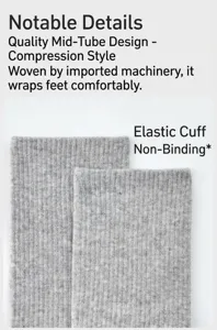 Detail view of solid grey compression mid-tube yoga socks featuring elastic cuffs and comfortable knit.