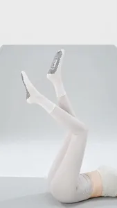 Professional grip yoga socks detail view, featuring non-slip rubber dots and soft fabric.