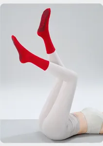 Non-slip yoga socks for women, professional pilates fitness athletic solid color mid-tube detail.