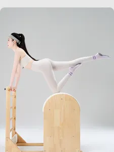 Detailed shot of women's non-slip pilates yoga socks in use during workout session.