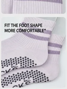 Close-up of light purple striped yoga socks with anti-slip dots for fitness pilates.
