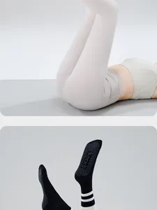 Non-slip grip yoga socks detail view, featuring dotted soles and comfortable mid-tube fit.