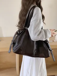 Large capacity dark brown leather tote bag, soft slouchy shoulder travel bag, detailed view.