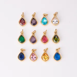 Detailed view of colorful teardrop birthstone pendants, gold-edged DIY jewelry charms.