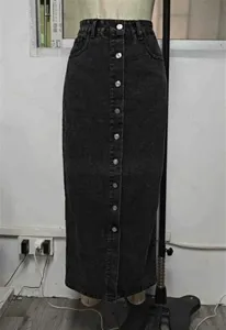 Detailed view of women's vintage retro high waist single breasted denim midi skirt style.