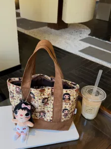 Cute plaid canvas cosmetic bag with doll pendant, portable makeup storage pouch for women.