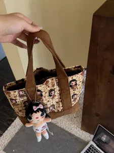 Cartoon print canvas tote bag with plush doll pendant, casual student handbag for daily use.