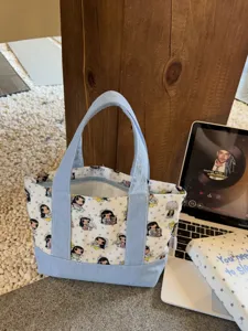 Cute cartoon canvas tote bag with zipper, portable small cosmetic and stationery storage pouch.